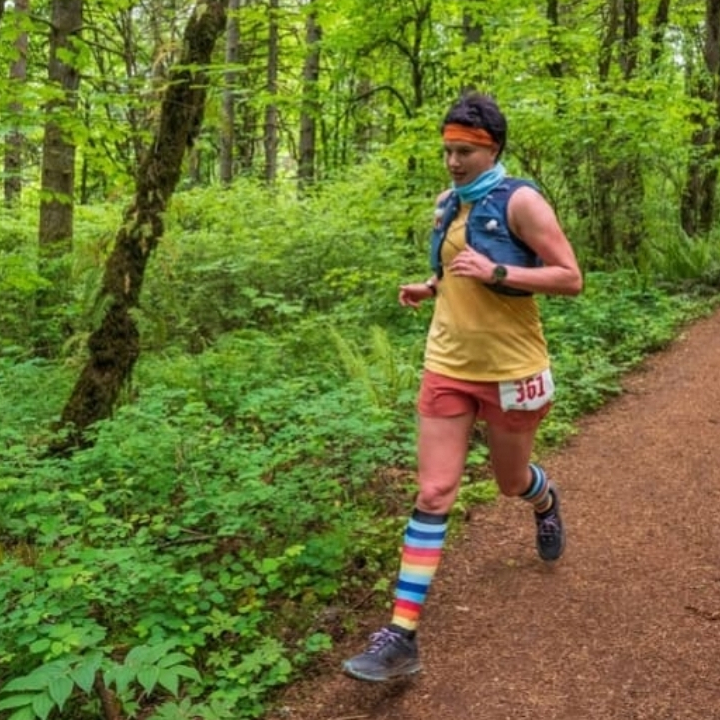 Biz on trail with colorful socks