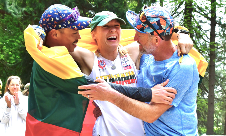 Julija Šorytė, having won, celebrating with Eric Yan (left) and Scott Martin (right)